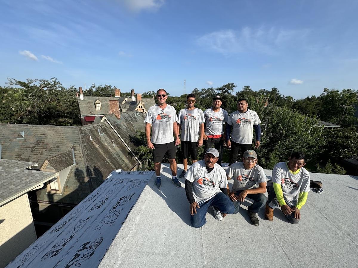 The Anything and Everything Roofing crew on a New Orleans rooftop