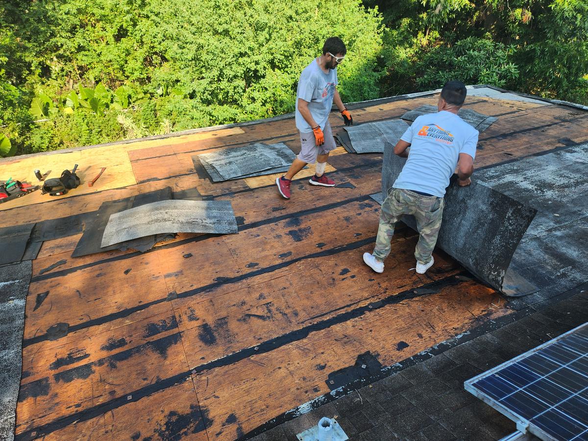 Tearing off an old flat roof down to the deck