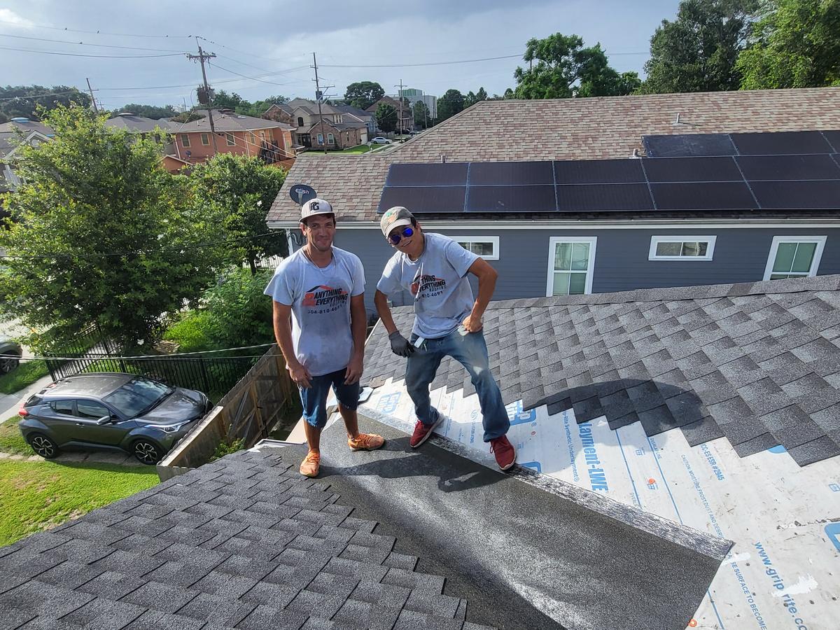 Two of our roofers on a shingle roof repair in New Orleans