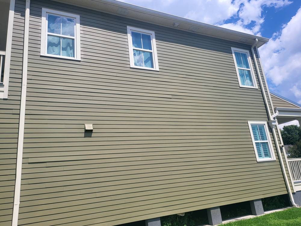 Two-story home with new fiber cement lap siding