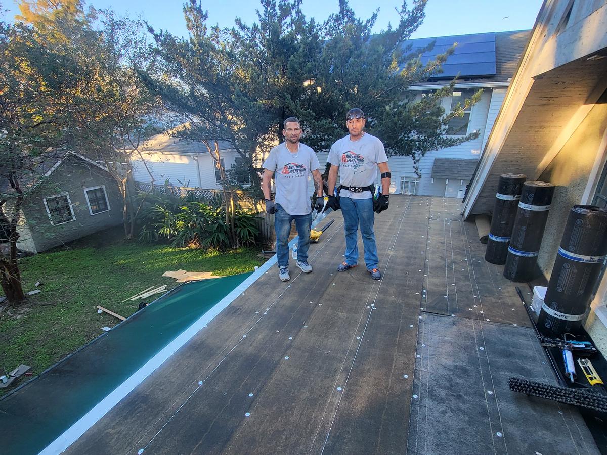 Our crew on a flat roof with base sheet fastened down